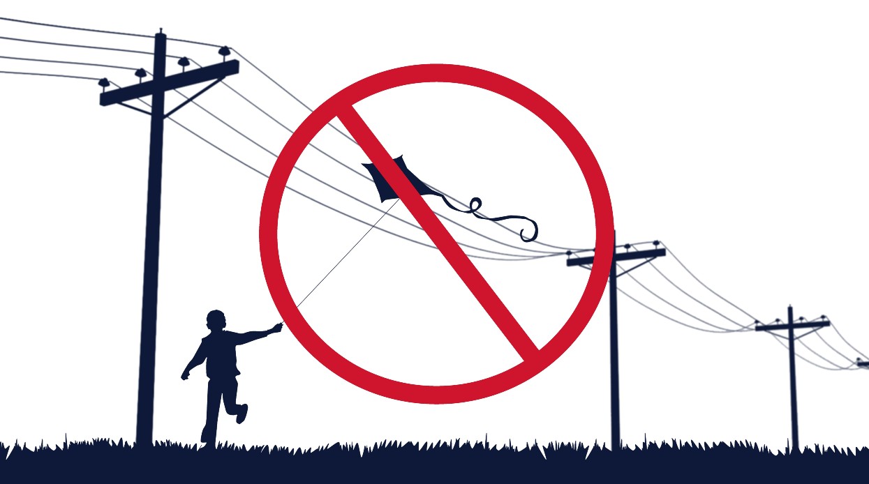 Child flying a kite close to the power line