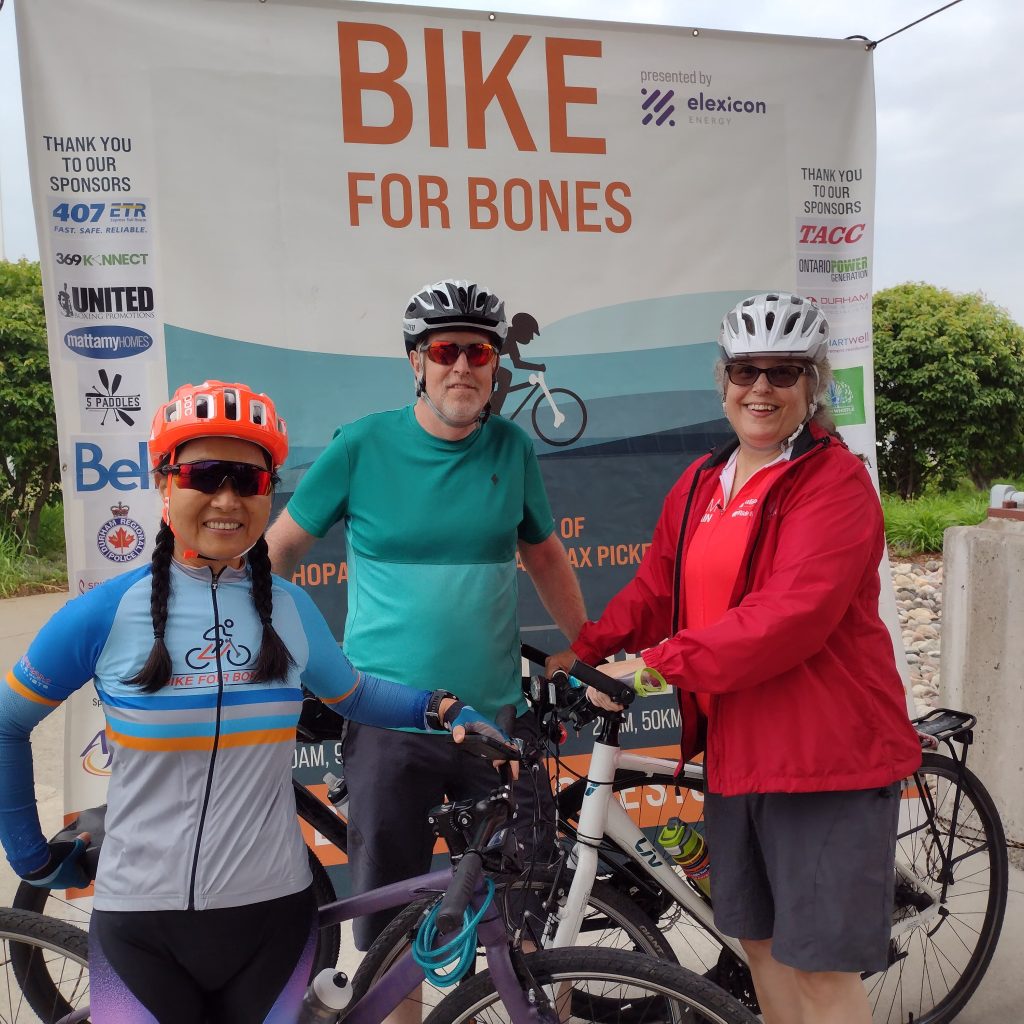 Elexicon Energy - Bike For Bones Event - Three people standing with bikes